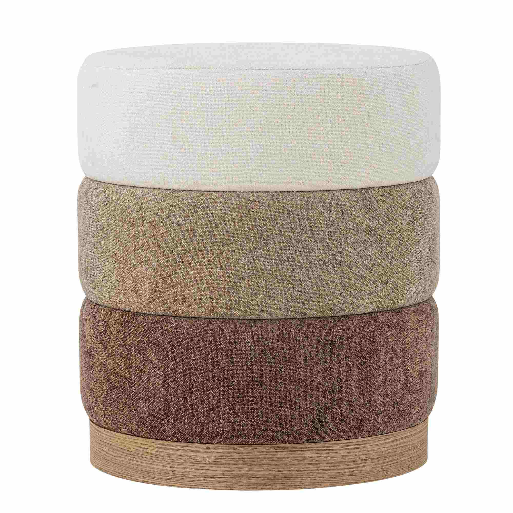 Pouf rond à trois couronnes empilées en velours et bouclé écru, brun chiné et brun profond, sur socle de bois clair.