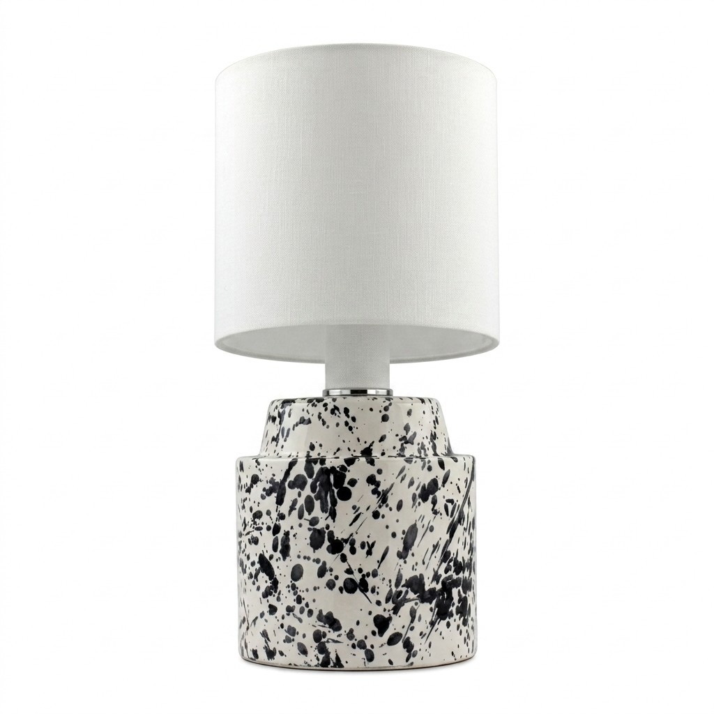 Lampe à poser en céramique blanche émaillée main, base criblée d'éclaboussures noires et abat-jour cylindrique blanc